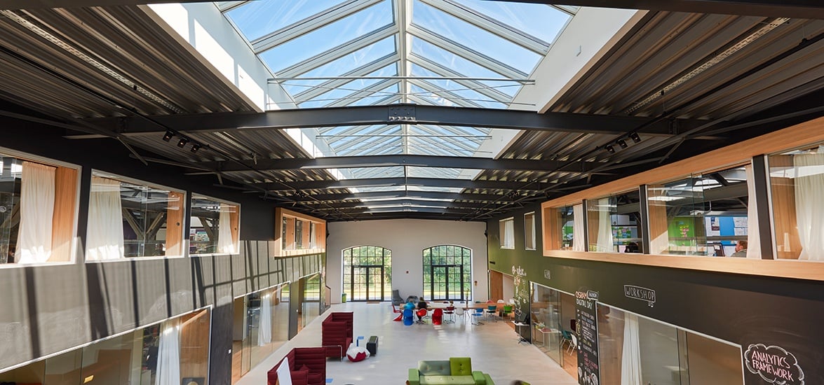 School hall illuminated with natural light through roof skylights 