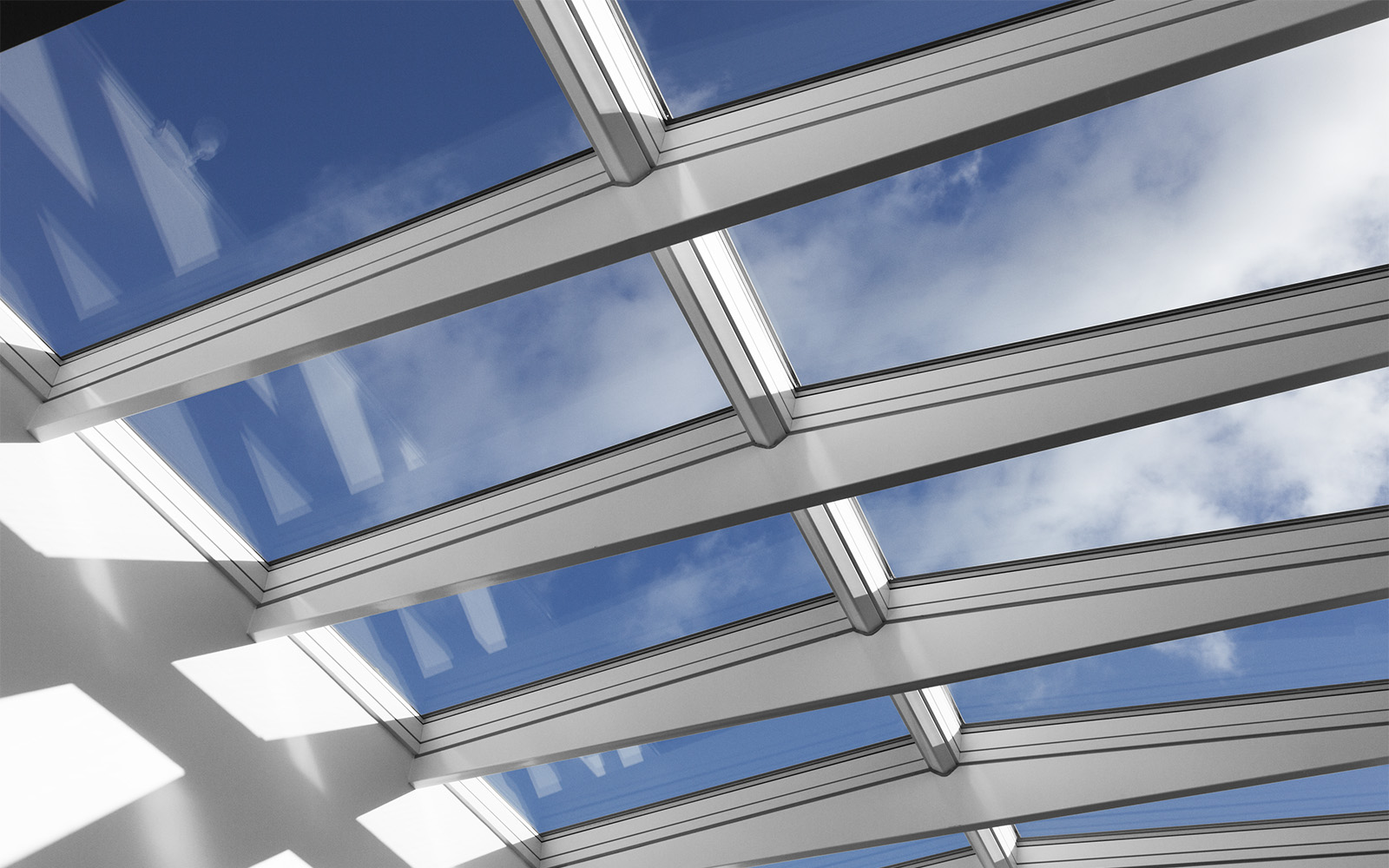 Clear blue sky view through roof skylights